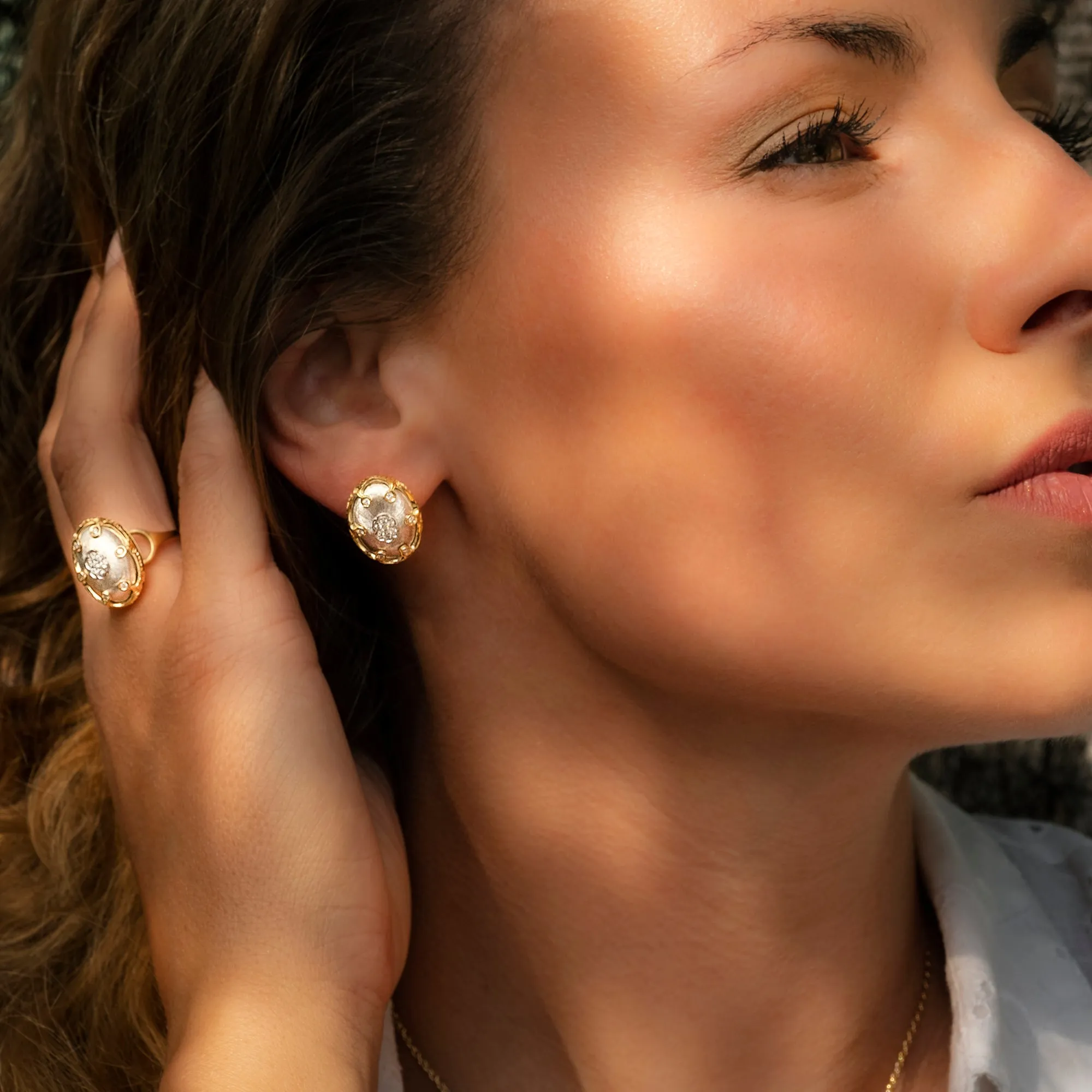 Hand engraved 18k yellow gold Crown earrings